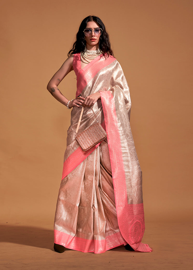 Close-up of a Peach Kanjipuram Silk Woven Designer Saree showing intricate gold weaving.