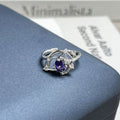 Minimalist purple fire rhinestone open ring on a female finger