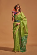 Light parrot green handloom silk traditional saree with intricate weaving
