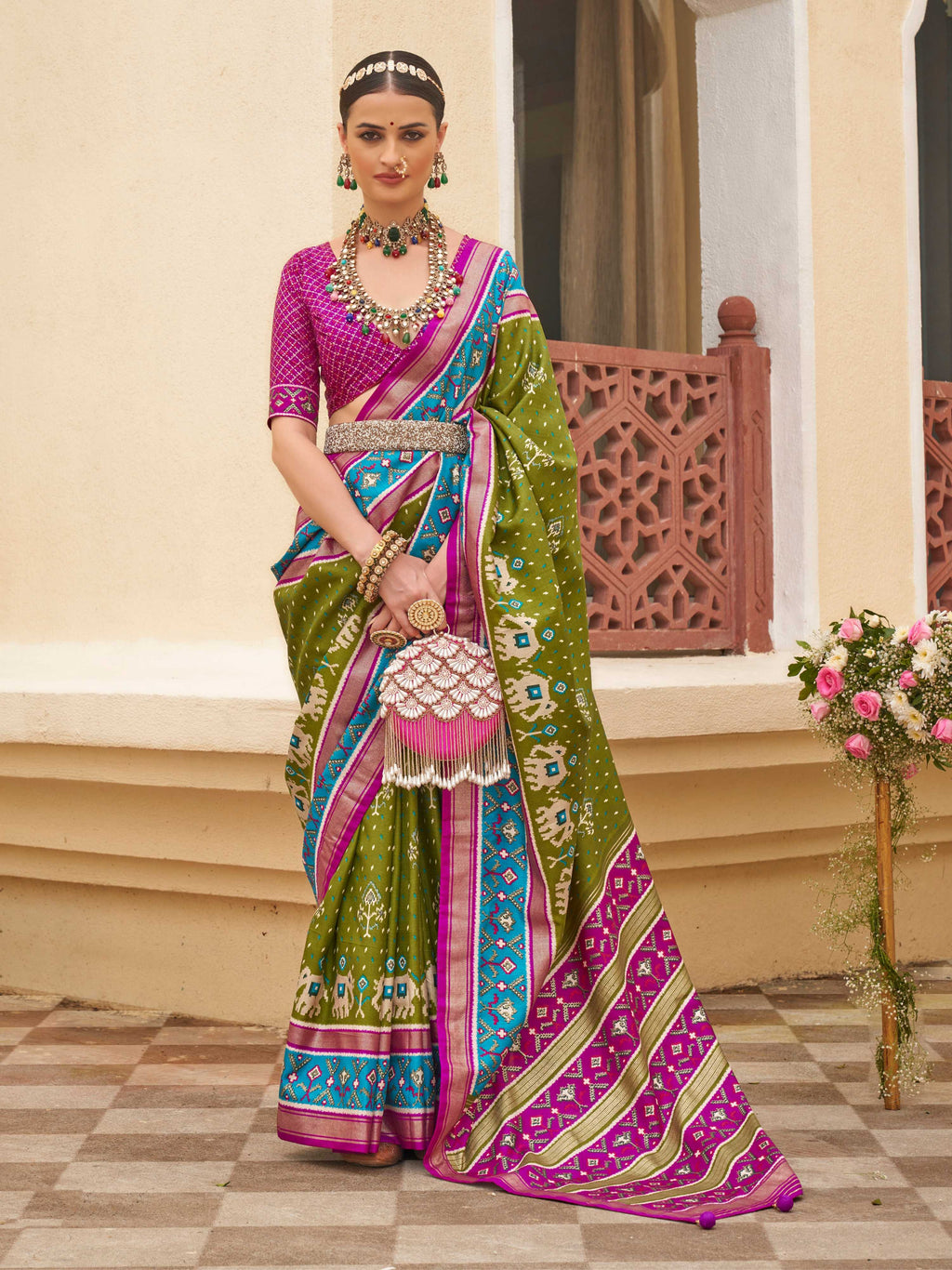 Multi-color sigma silk patola printed saree featuring mehendi green, magenta pink, and cyan blue