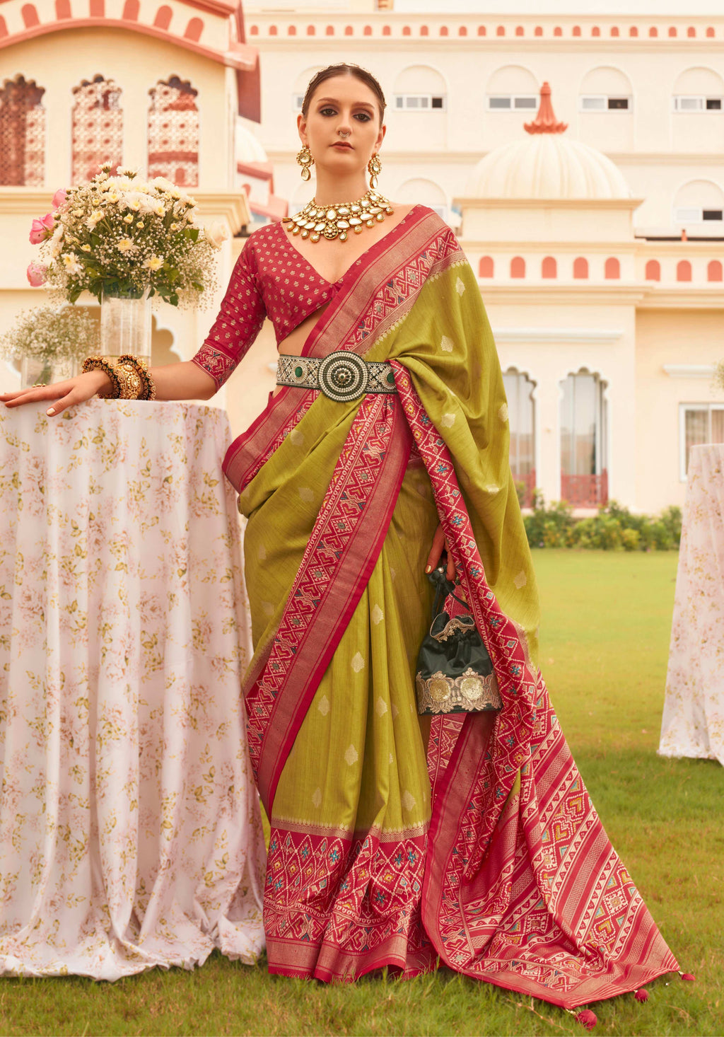 Olive and Maroon Sigma silk saree with intricate Patola-style patterns.