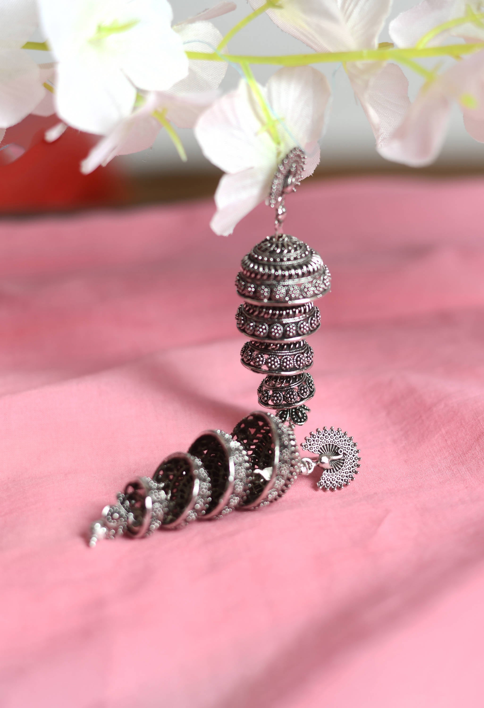Elegant Peacock Motif Silver Colour Statement Earrings