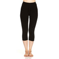 Women's 3/4 length black merino wool ski base layer leggings with a tapered fit