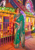 Green handloom silk blend saree with intricate zari hand-woven border and pallu.
