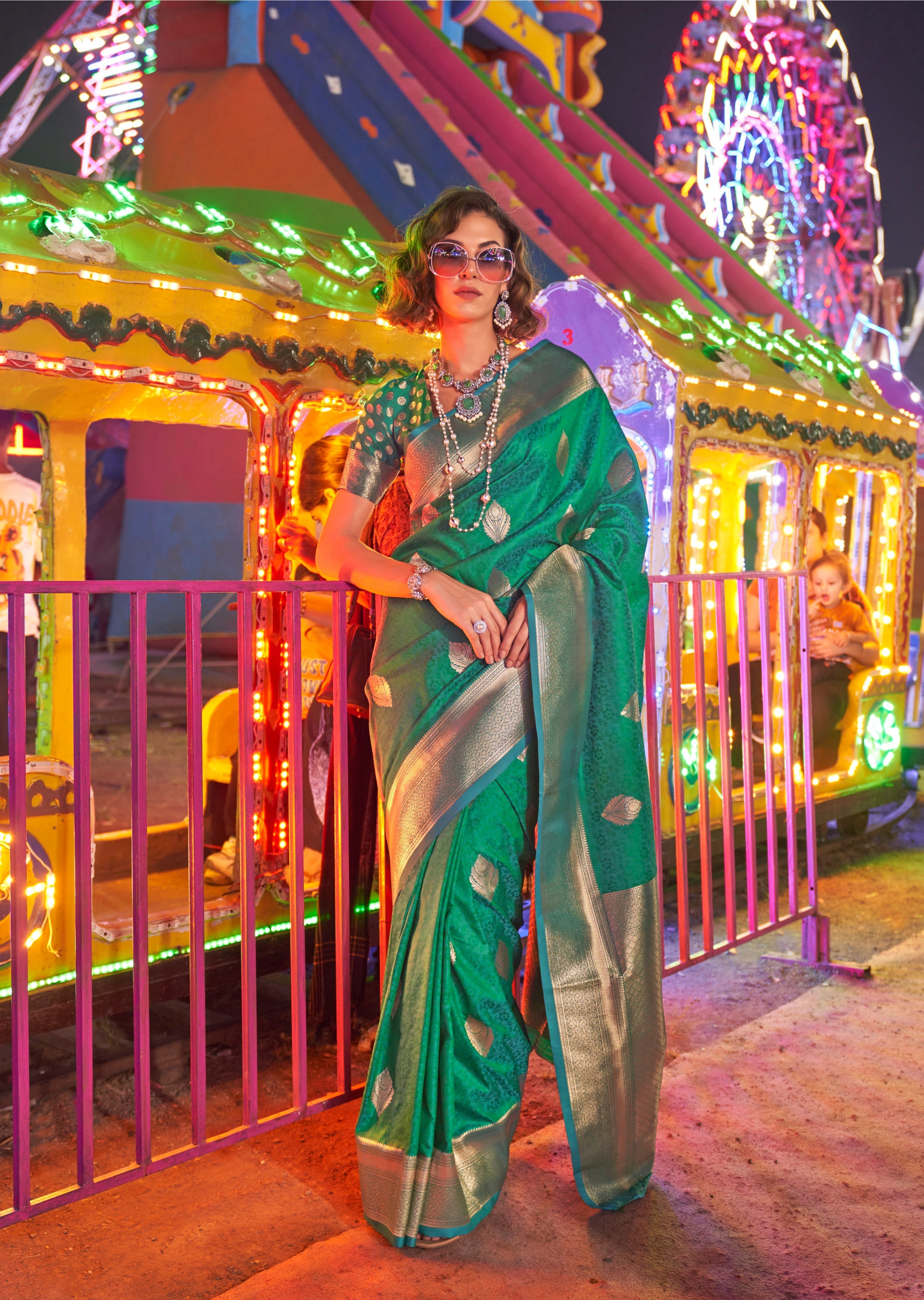 Green handloom silk blend saree with intricate zari hand-woven border and pallu.