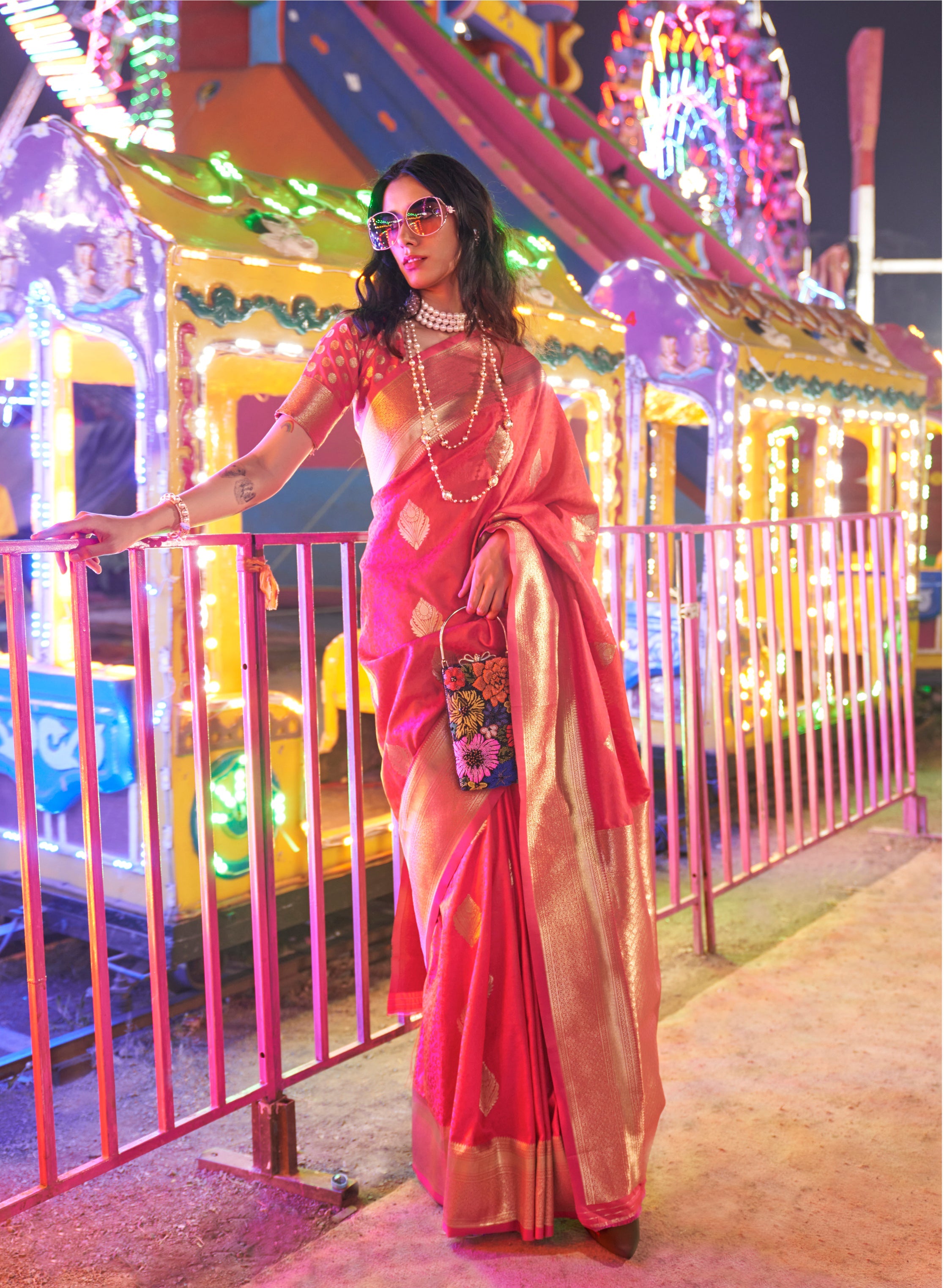 Pink handloom silk blend saree with intricate zari woven border and matching blouse