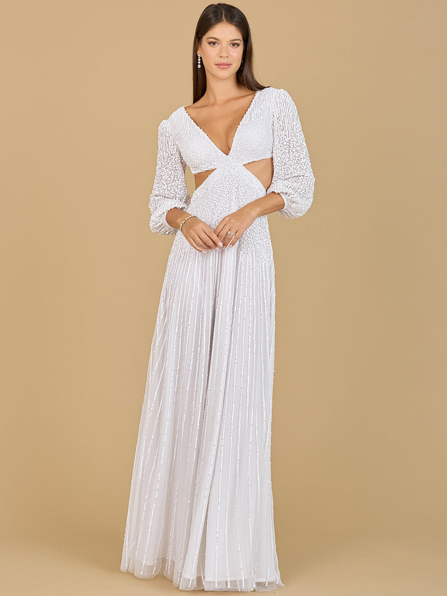 Model wearing a white long sleeve wedding gown with beaded bodice, cut-outs, and a lace-up back design.