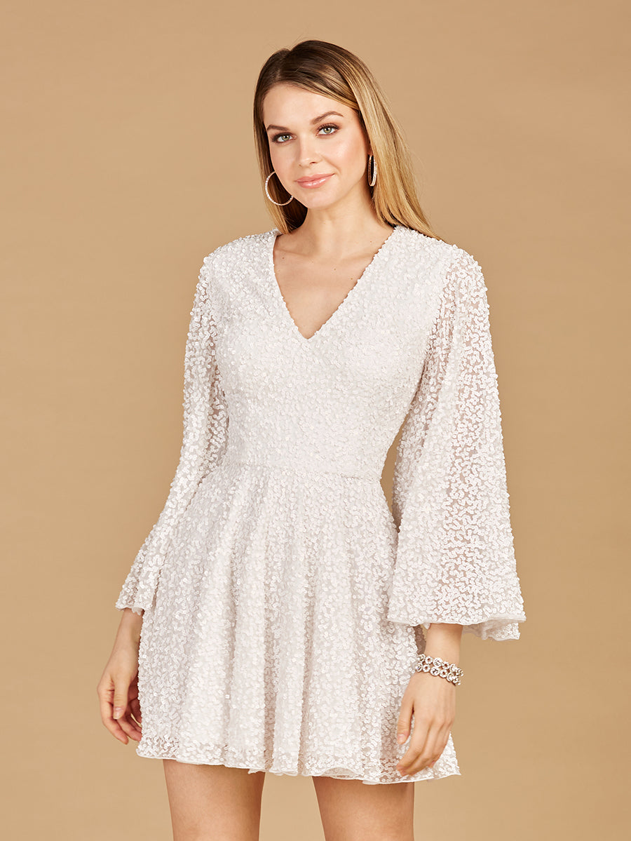Front and back view of a woman wearing a white sequin cocktail dress with bell sleeves