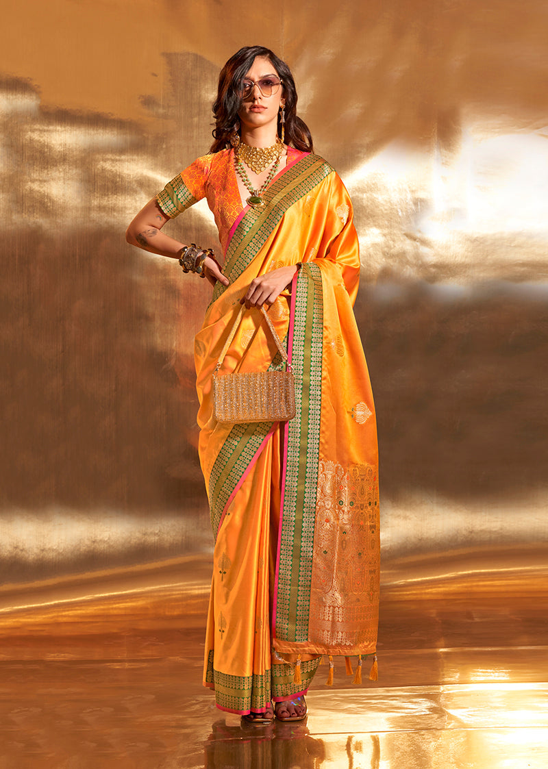 Yellow satin silk designer saree with gold zari woven buta and ethnic border