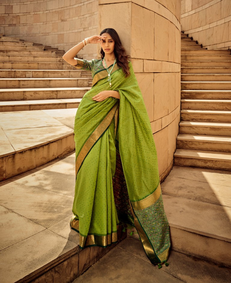 Green handloom silk patola print saree with matching blouse