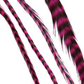 Close up of vibrant striped magenta feather hair extensions for styling