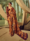 Monjolika Fashion multicolor digital print satin saree in burnt orange and espresso brown