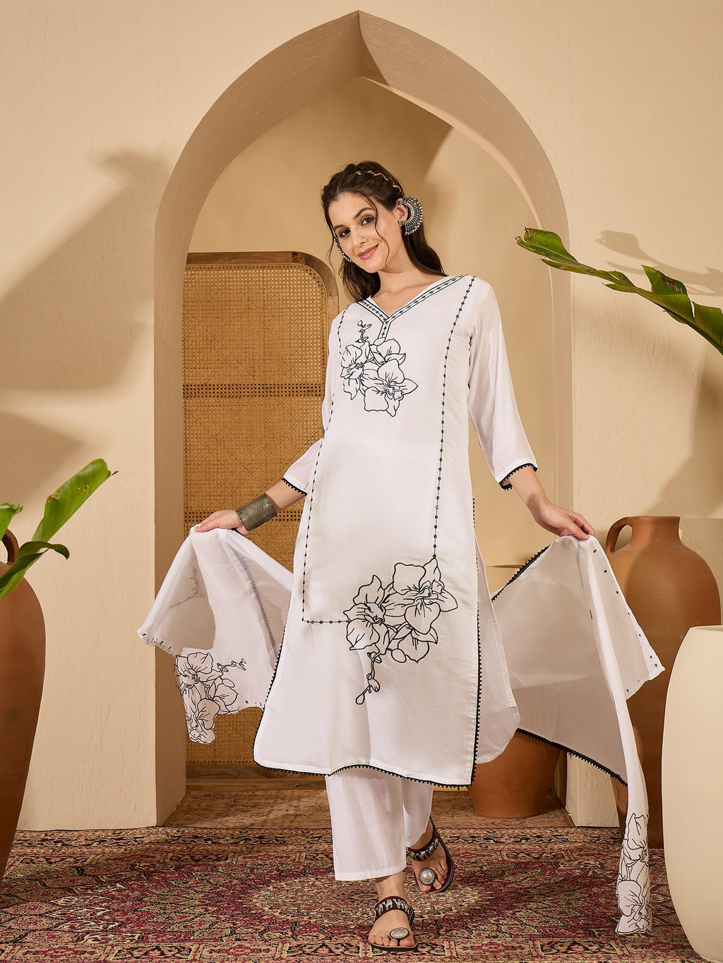 Elegant white silk kurta set with intricate embroidery for women