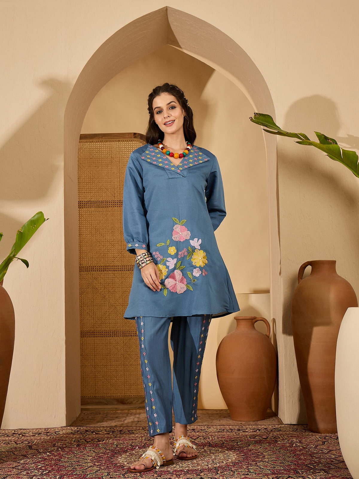 Elegant blue silk kaftan-style kurta set with artistic embroidery