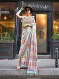Model draped in an off-white satin georgette designer saree
