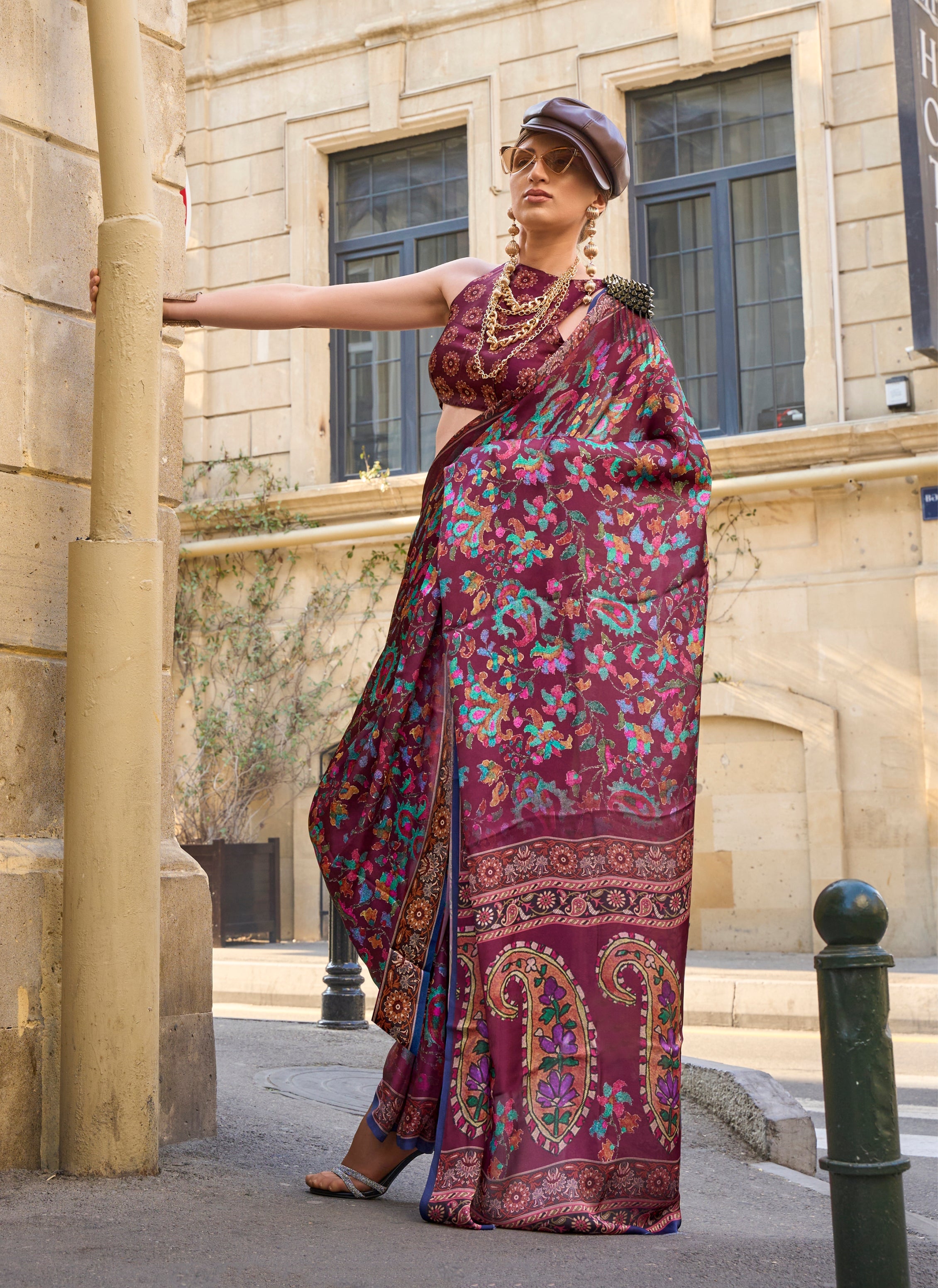 Lightweight wine-colored satin georgette saree featuring a smooth, flowing drape.