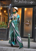 Elegant Dark Green Satin Georgette saree with a fluid, lightweight drape.