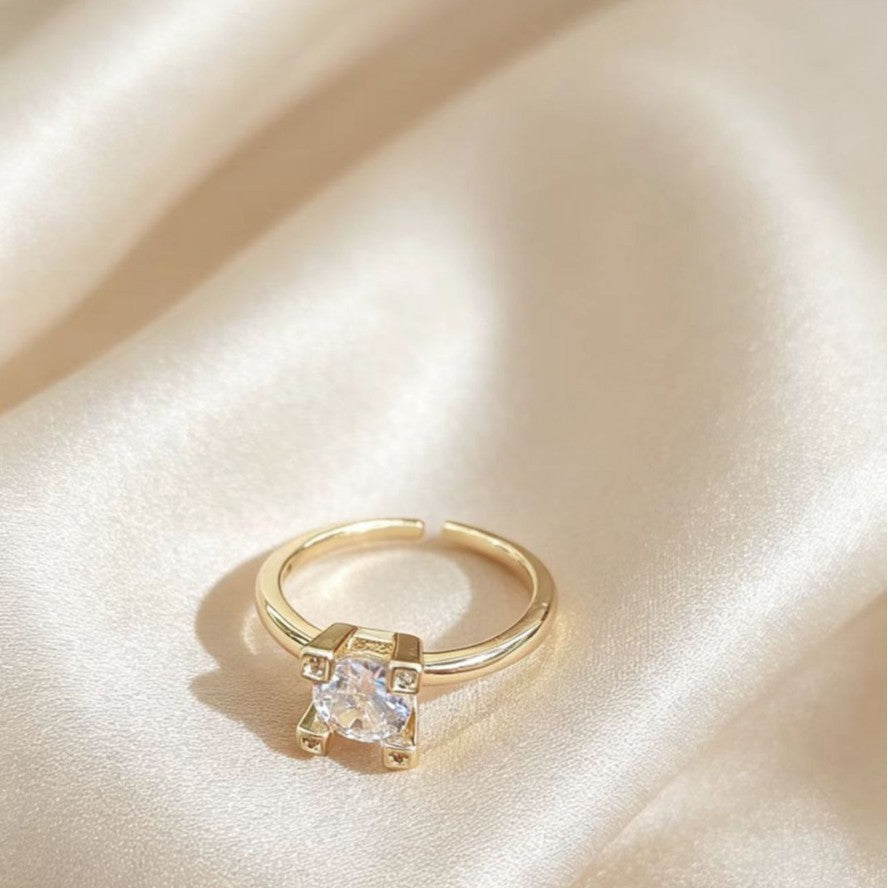 Elegant gold-toned open ring with modern square design for women