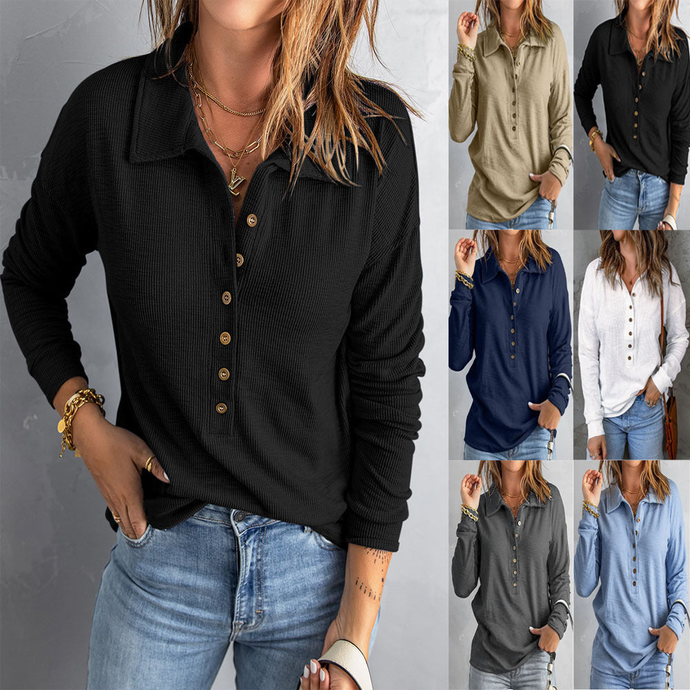 A woman wearing a long sleeve waffle knit polo shirt with button detail.