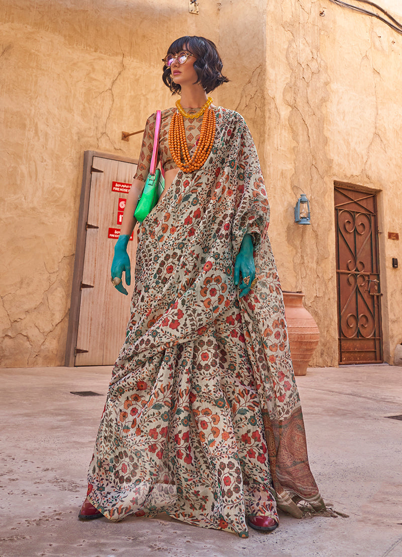 Model wearing a light grey tissue saree with floral prints