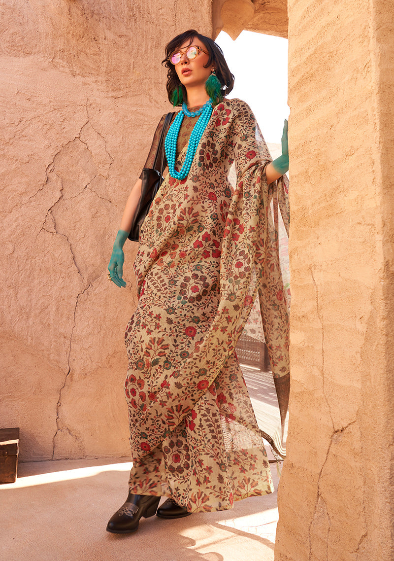 Close up of a beige tissue saree featuring elegant floral printing