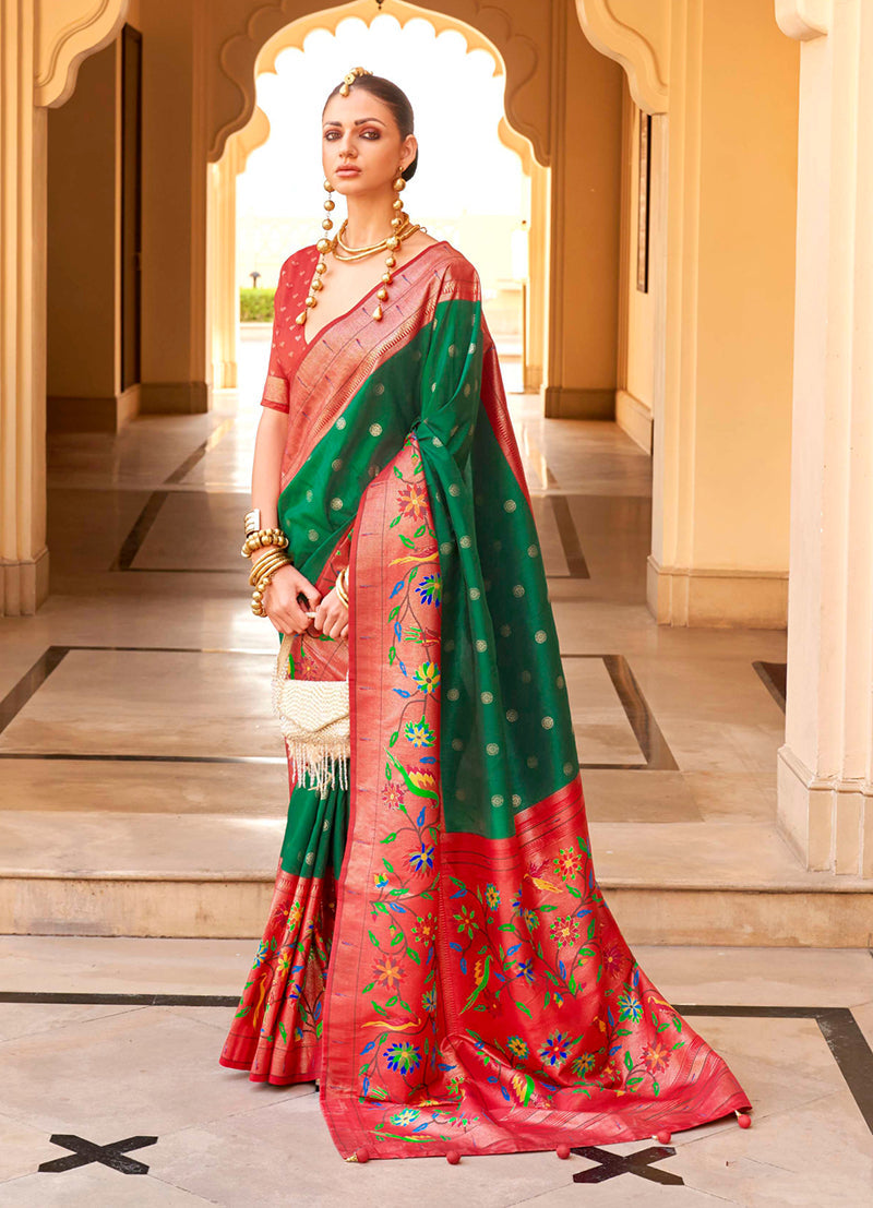 Beautiful green soft silk saree decorated with traditional woven motifs and rich borders.