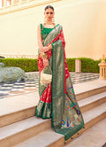 A beautiful crimson soft silk saree with traditional Paithani weaving motifs and gold detailing.