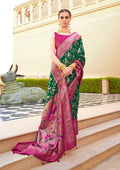Dark Green soft silk saree with intricate traditional motifs.