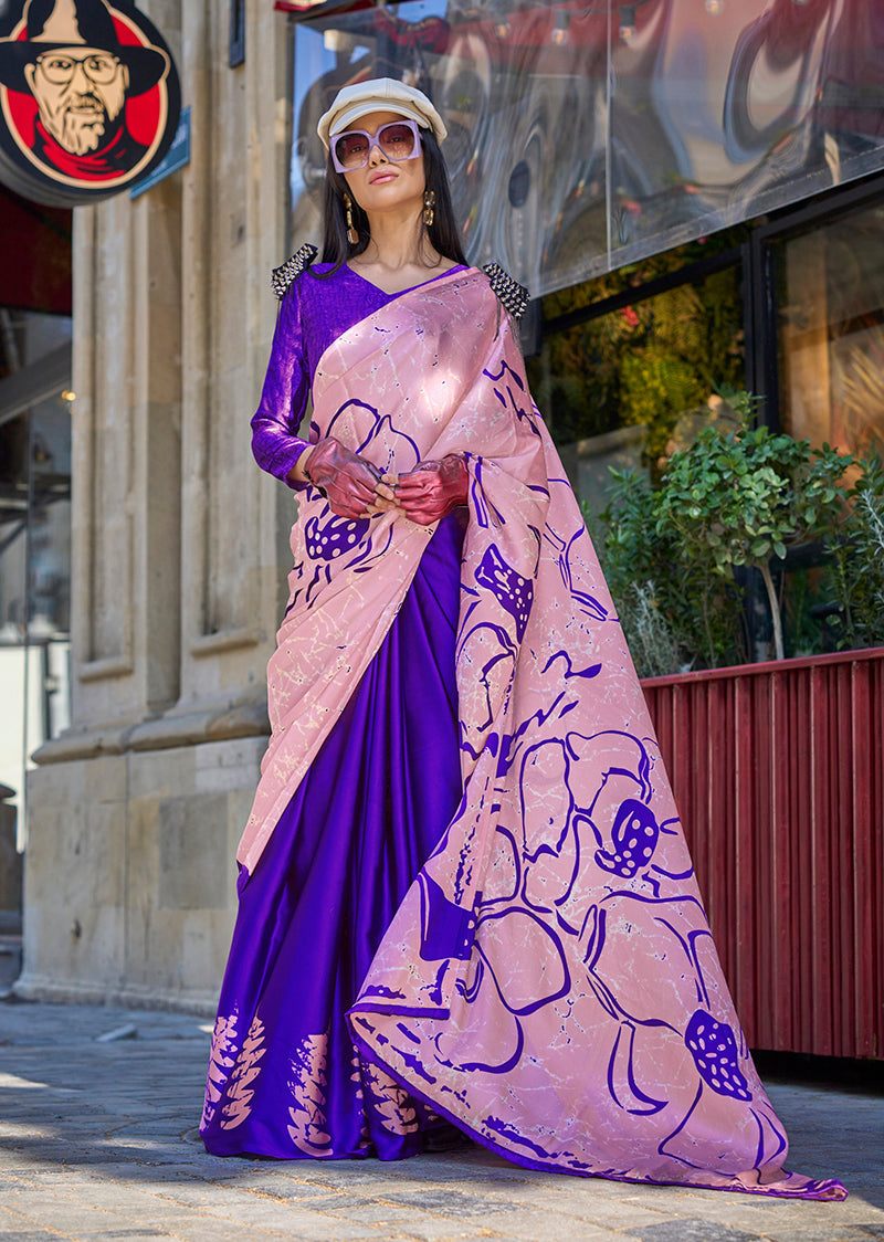 A beautiful baby pink satin silk printed saree with a matching blouse, draped elegantly.