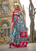Grey satin silk saree with elegant prints, showcasing a lustrous finish.
