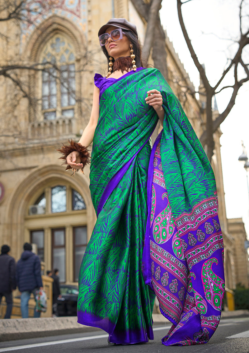 Woman wearing a Royal Blue Satin Silk printed saree with a smooth finish