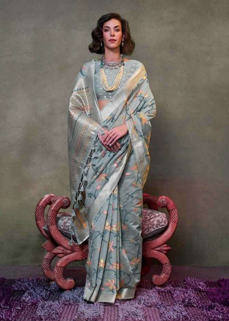 Slate grey mulmul cotton saree with intricate patterns and soft drape