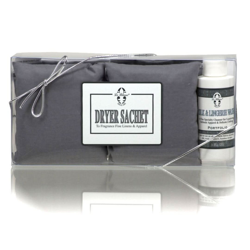 Neutral grey Le Blanc dryer sachets in minimalist white packaging with soft floral imagery.