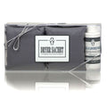 Neutral grey Le Blanc dryer sachets in minimalist white packaging with soft floral imagery.
