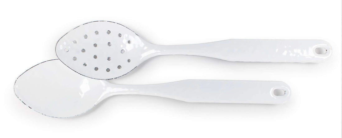 A 12-inch solid white enamelware serving and slotted spoon set with stainless steel trim.