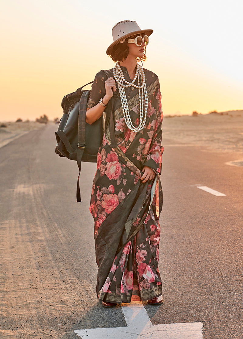 Black Tussar silk saree featuring floral prints and a decorative weaved border