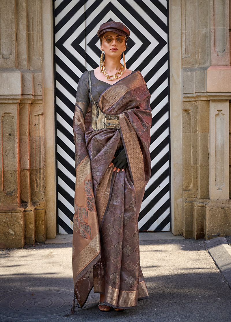 Close up of a brown handloom organza silk saree showing intricate fabric texture