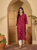 Maroon viscose rayon tunic featuring intricate embroidery, worn as a chic festive kurti