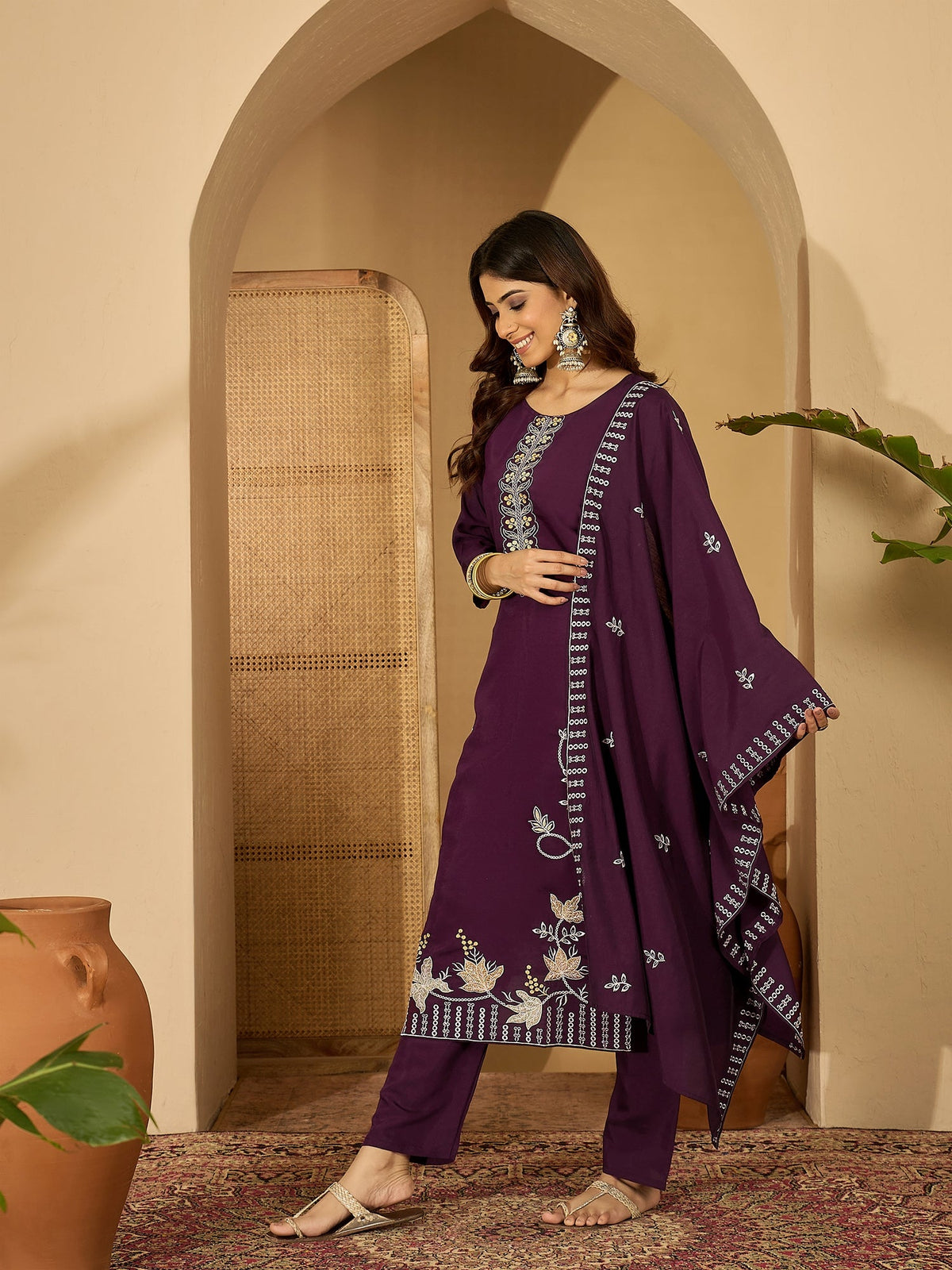 Deep purple silk kurta for women with intricate embroidery around the round neckline