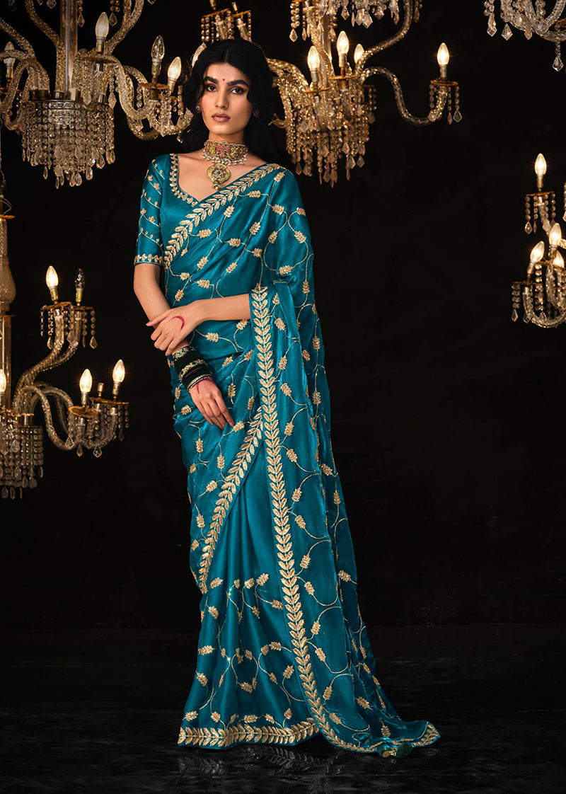 Dark blue tissue silk saree with intricate zari embroidery