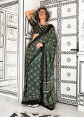 Dark green satin crepe saree with abstract screen prints.
