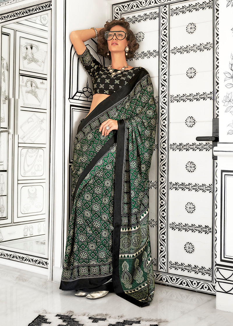 Dark green satin crepe saree with abstract screen prints.