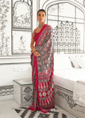 A glamorous black and maroon printed satin crepe saree with an abstract design.