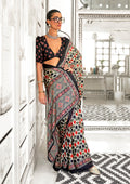 A modern, fitted women's V-neck satin top with an abstract print in black, olive-green, and brick red by Dista.