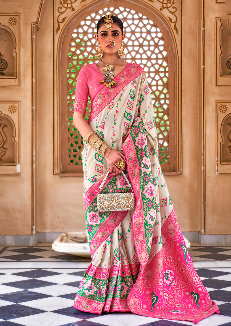 Elegant white Banarasi silk saree with refined woven patterns.