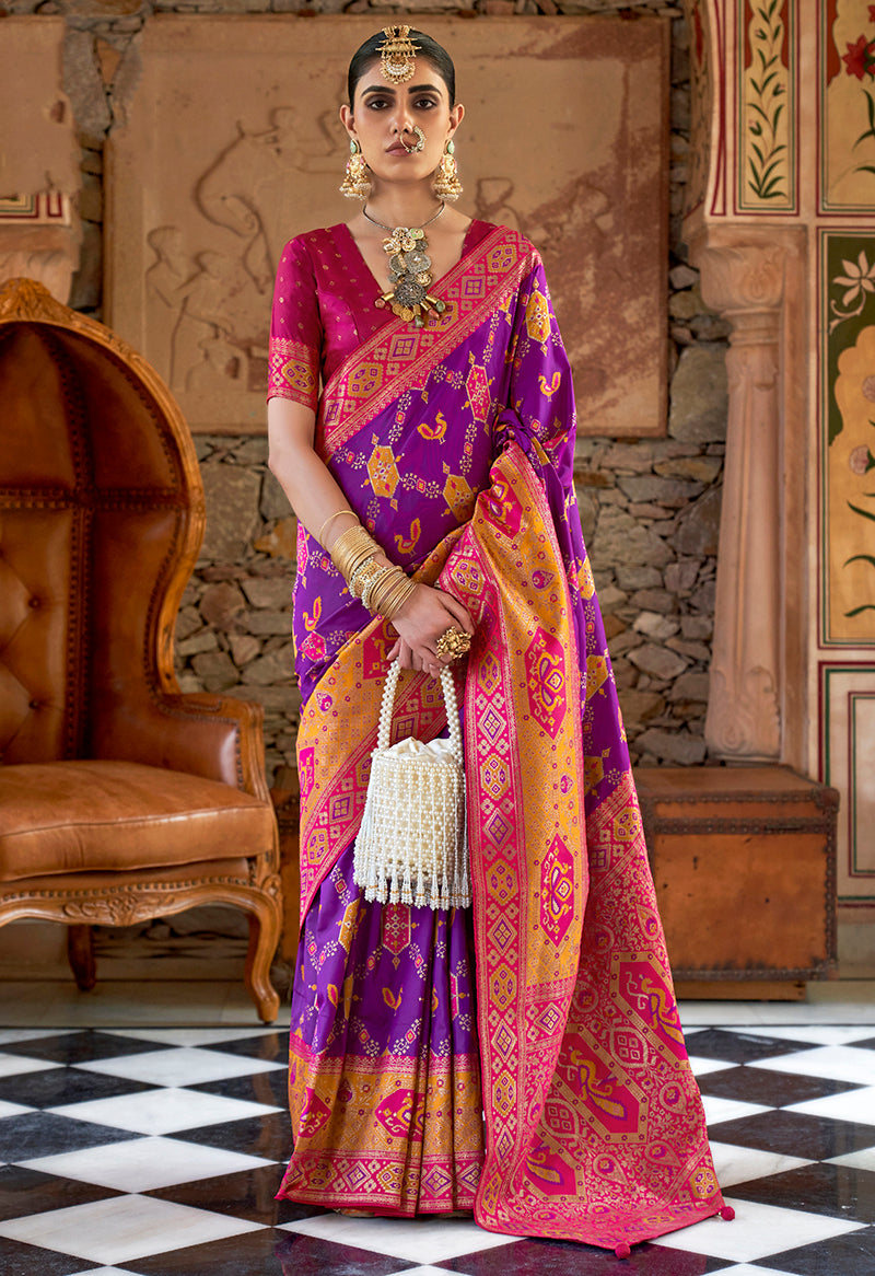 Purple Banarasi silk saree with ornate traditional weaving patterns.