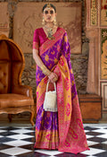 Purple Banarasi silk saree with ornate traditional weaving patterns.
