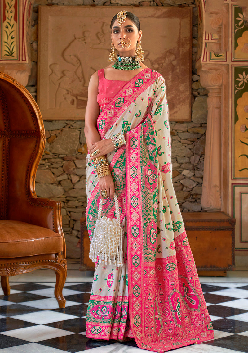 Traditional white Banarasi silk saree with detailed woven patterns