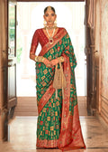 Contemporary green Banarasi silk saree with delicate weaving patterns.