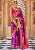 Beautiful pink Banarasi silk saree with detailed weaving, perfect for party wear.